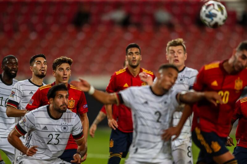 Germany and Spain players compete for the ball. AP Photo