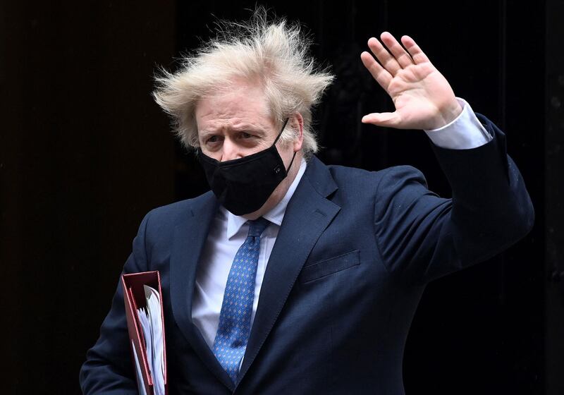 Britain's Prime Minister Boris Johnson, wearing a protective face covering to combat the spread of the coronavirus, leaves 10 Downing Street in central London on March 10, 2021, to take part in the weekly session of Prime Minister's Questions (PMQs) at the House of Commons.  / AFP / -
