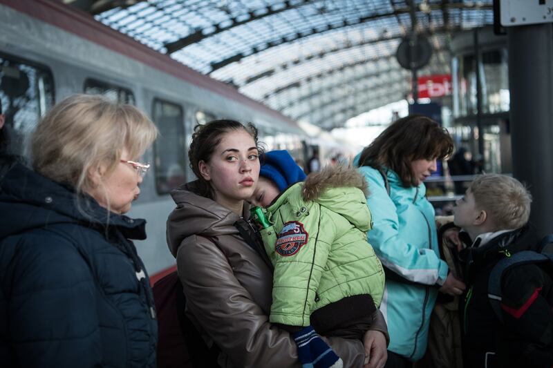 People fleeing Ukraine arrive on a train at the main railway station in Berlin. Getty