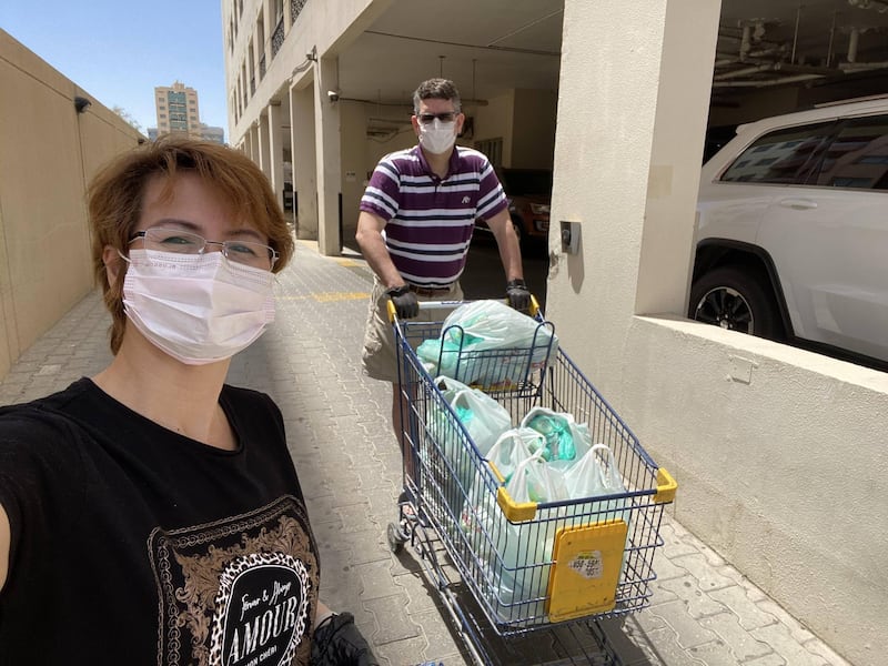 Loreli and John Cowling are part of a Dubai badminton group who have organised the delivery of essential food supplies to struggling families. Courtesy: Dubai Badminton Together Against Covid 19