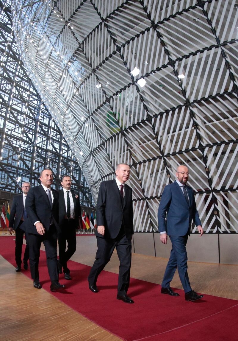 EU Council President Charles Michel (R) with Turkish President  Erdogan (C) and Turkish Foreign Minister Mevlut Cavusoglu (L) attend their meeting at the European Council in Brussels.  EPA