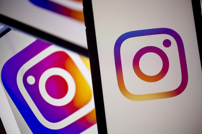 The Facebook Inc. Instagram logo is displayed on an Apple Inc. iPhone in an arranged photograph taken in Arlington, Virginia, U.S. on Monday, April 29, 2019. Facebook's sales gains are increasingly being driven by photo-sharing app Instagram and advertising in its Stories feature, a Snapchat copycat. Photographer: Andrew Harrer/Bloomberg