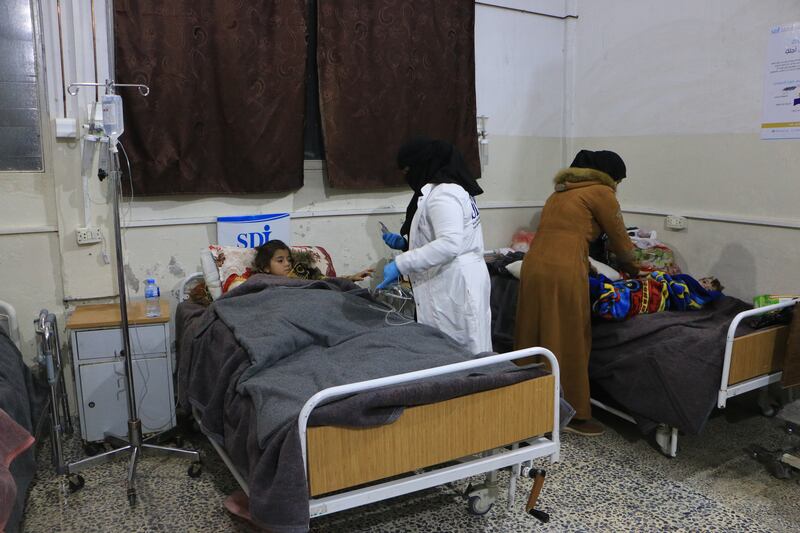 Jinan and her brother Abdul-Fatah stayed at Harem Central Hospital for a month after they were pulled out from the rubble. Abd Almajed Alkarh / The National