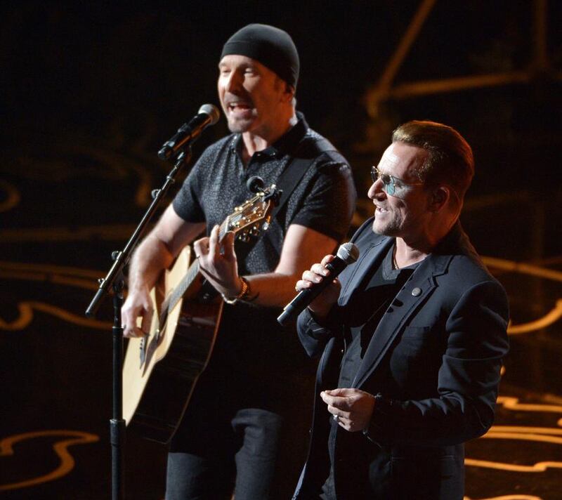 The Edge, left, and Bono of U2 perform on stage. John Shearer / Invision / AP