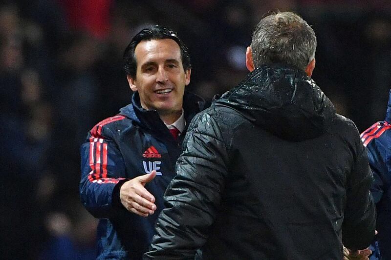 Arsenal's head coach Unai Emery shakes hands with Manchester United's manager Ole Gunnar Solskjaer after the match. AFP