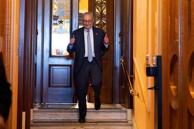 Senate Majority Leader Chuck Schumer gestures as he walks off the Senate floor after the Senate passed the Inflation Reduction Act, on Capitol Hill in Washington, on August 7. EPA