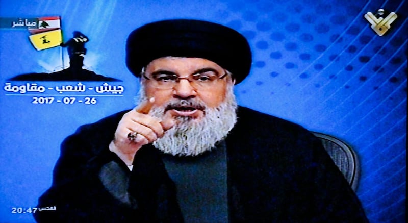 epa06111359 A grab picture from Hezbollah's al-Manar TV shows Hezbollah leader Sayyed Hassan Nasrallah giving a televised address from an undisclosed location in Lebanon, 26 July 2017. Nasrallah spoke about the victory of Hezbollah during a military operation against the so-called Islamic State (IS or ISIS) and Al-nusrah Front militant groups in Jurud Arsal mountainous region bordering with Syria. Hezbollah began five days ago an offensive to clear radicals from the town of Arsal and al-Qalamoun along the Lebanese Syrian border.  EPA/HEZBOLLAH MEDIA OFFICE / AL-MANAR TV GRAB