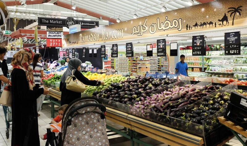 Dubai, United Arab Emirates, Jun 18, 2014 -  Customers at the vegetables section with a banner that says " Ramadan Kareen" inside the Geant supermarket at Ibn Batuuta Mall. ( Jaime Puebla / The National Newspaper ) 