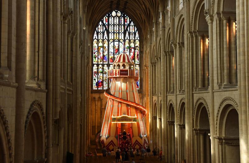 A large helter skelter is installed inside Norwich Cathedral, in Norwich, England as part of the 'Seeing It Differently' project which aims to give people the chance to experience the Cathedral in an entirely new way and open up conversations about faith, Thursday Aug. 8, 2019. (Joe Giddens/PA via AP)