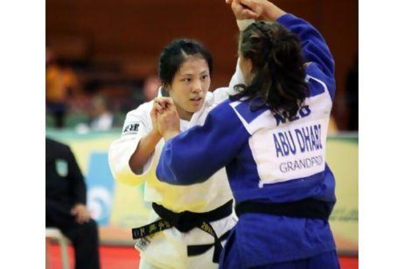 Japan's Haruka Tachimoto, left, was the winner in the women's 70kg category.