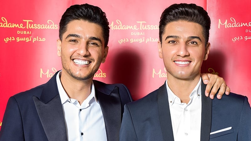 Mohammed Assaf with his waxwork figure, which will be on display at Madame Tussauds Dubai