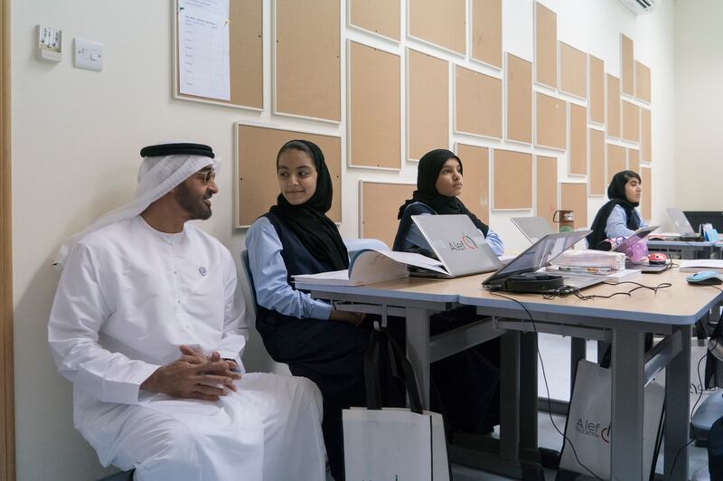 Mohamed bin Zayed speaks to a pupil during a lesson. Photo: @MohamedBinZayed