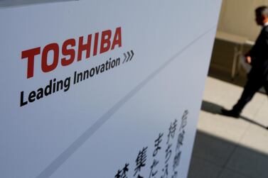 A shareholder arrives at a Toshiba previous shareholders meeting at Chiba, Japan in 2017. A shareholder advocacy group and the company's third-biggest investor are calling for the removal of board directors following its handling of a key vote last year. Reuters