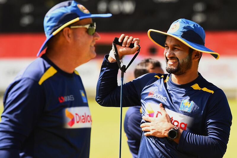 Sri Lanka cricket captain Dimuth Karunaratne, right, and head coach Mickey Arthur attend a practice session at the Colombo Colts Cricket Stadium in Colombo on June 2, 2020. AFP