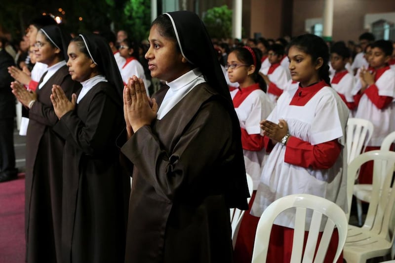 Nuns pray during Christmas Eve Mass in the UAE. Christopher Pike / The National