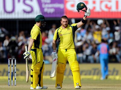 Australia cricket player Aaron Finch celebrates his hundred as captain Steven Smith look at him during the third one-day international cricket match between India and Australia in Indore, India, Sunday, Sept. 24, 2017. (AP Photo/Rajanish Kakade)