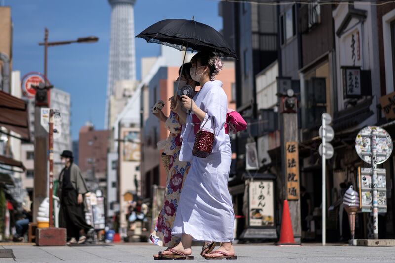 Women in rental kimonos walk through the Asakusa area in Tokyo, Japan. Getty Images