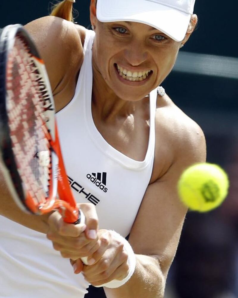 Angelique Kerber of Germany returns to Venus Williams of the US during their women’s singles match on day eleven of the Wimbledon Tennis Championships in London, Thursday, July 7, 2016. (AP Photo/Kirsty Wigglesworth)