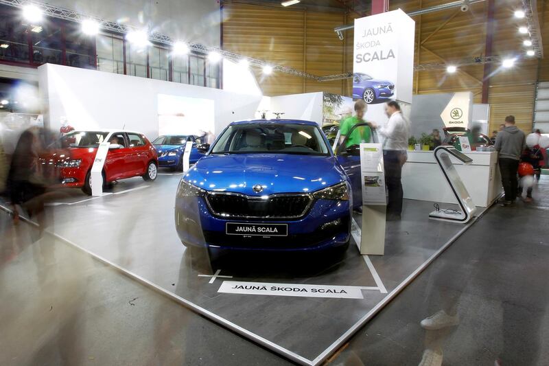 epa07503558 Visitors look at Skoda cars during the International Motor Show Auto 2019 in Riga, Latvia, 13 April 2019. The automotive industry event is the biggest in the Baltic countries and runs from 12 to 14 April.  EPA/TOMS KALNINS
