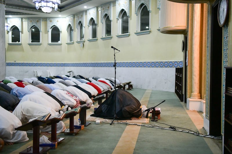 Worshippers at the first early morning Ramadan prayer at the Bani Hashim Mosque. Khushnum Bhandari / The National
