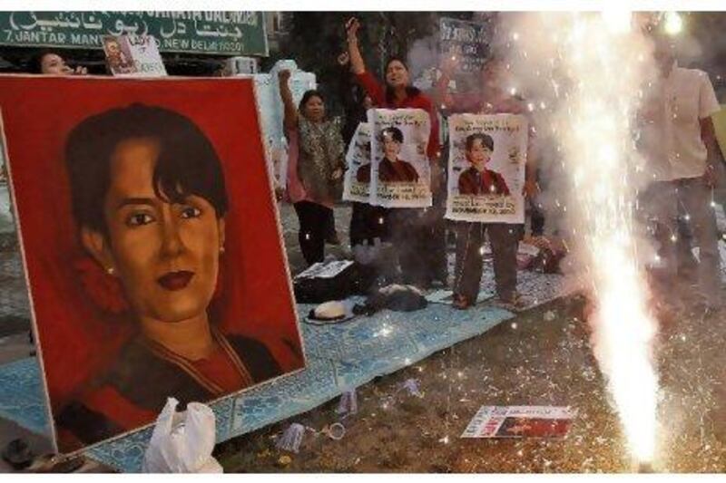 Supporters of Myanmar's pro-democracy leader Aung San Suu Kyi celebrate in New Delhi after her release from house arrest.