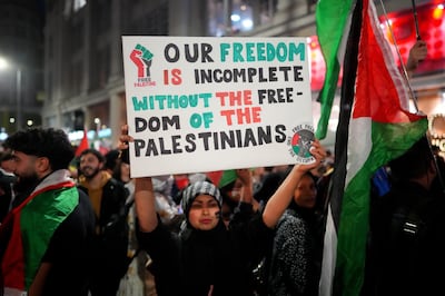 People take part in a demonstration in support of Palestine at the Israeli embassy in London. Getty Images