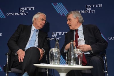 Former British prime ministers John Major, left, and Gordon Brown speak at the Institute for Government in London. Getty Images