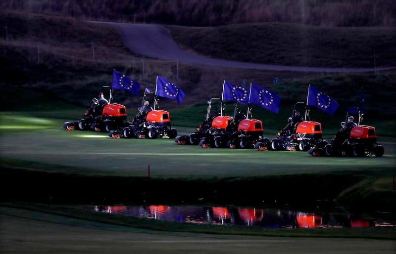 Lawn mowers are seen in the early morning ahead of the Ryder Cup 2018 tournament at The Golf National in Guyancourt, France.  EPA