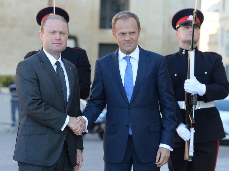 The EU president Donald Tusk, right, is welcomed by Maltese prime minister Joseph Muscat as he arrives in St Julian’s Malta on March 31, 2017 to announce the bloc’s stance on negotiations for Britain’s withdrawal. Matthew Mirabelli / AFP