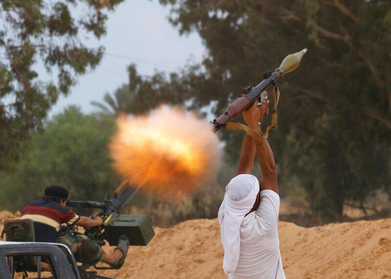 A fighter fires an RPG-7 during a skirmish in an area near the centre of Sirte in Libya. Reuters