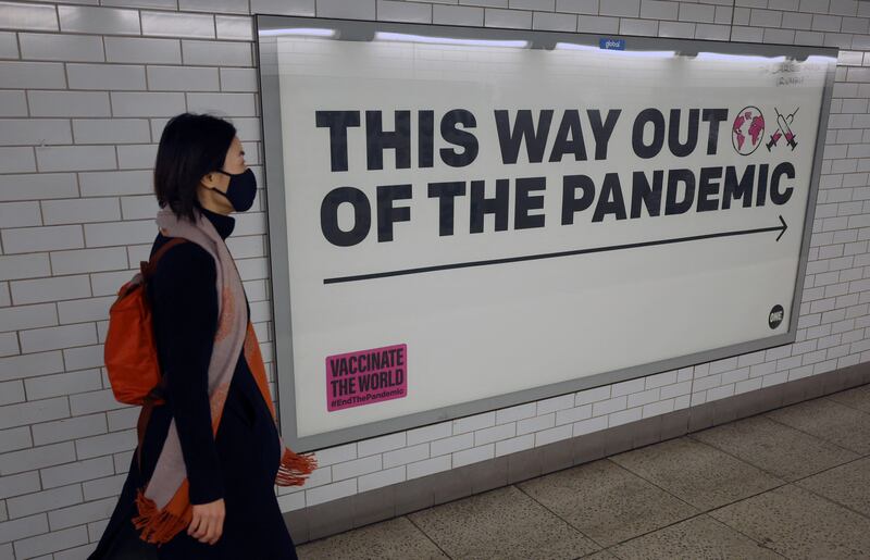 A sign pointing the way out of the pandemic on the London Underground. Reuters