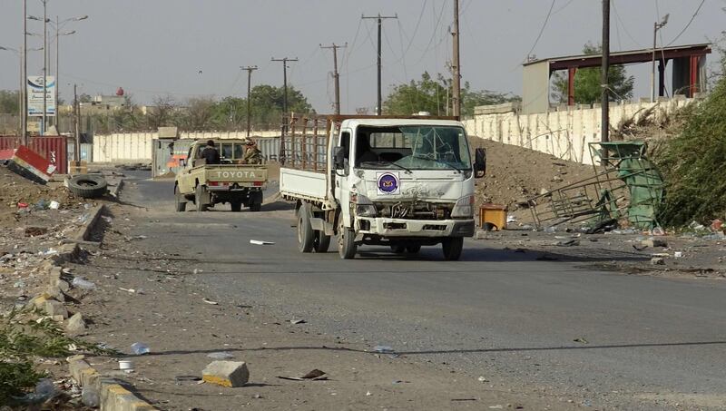 Yemeni pro-government forces steer their cars in the Huthi-held Red Sea port city of Hodeida on December 15, 2018. Residents of Yemen's flashpoint port of Hodeida and other cities fear a UN-brokered ceasefire could collapse at any moment, saying that after four years of conflict any accord is deeply fragile. / AFP / -
