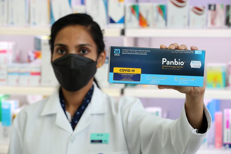 Pharmacist Riya Varghese shows one of the testing kits at Boots in Dubai. Chris Whiteoak / The National