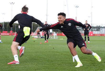 New signing Jadon Sancho (right) trains with James Garner. Getty Images