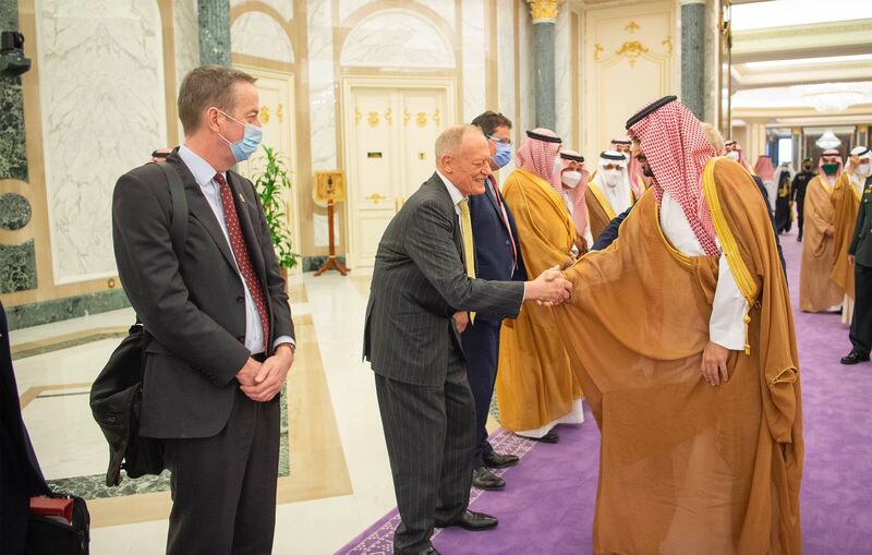 Prince Mohammed greets officials.