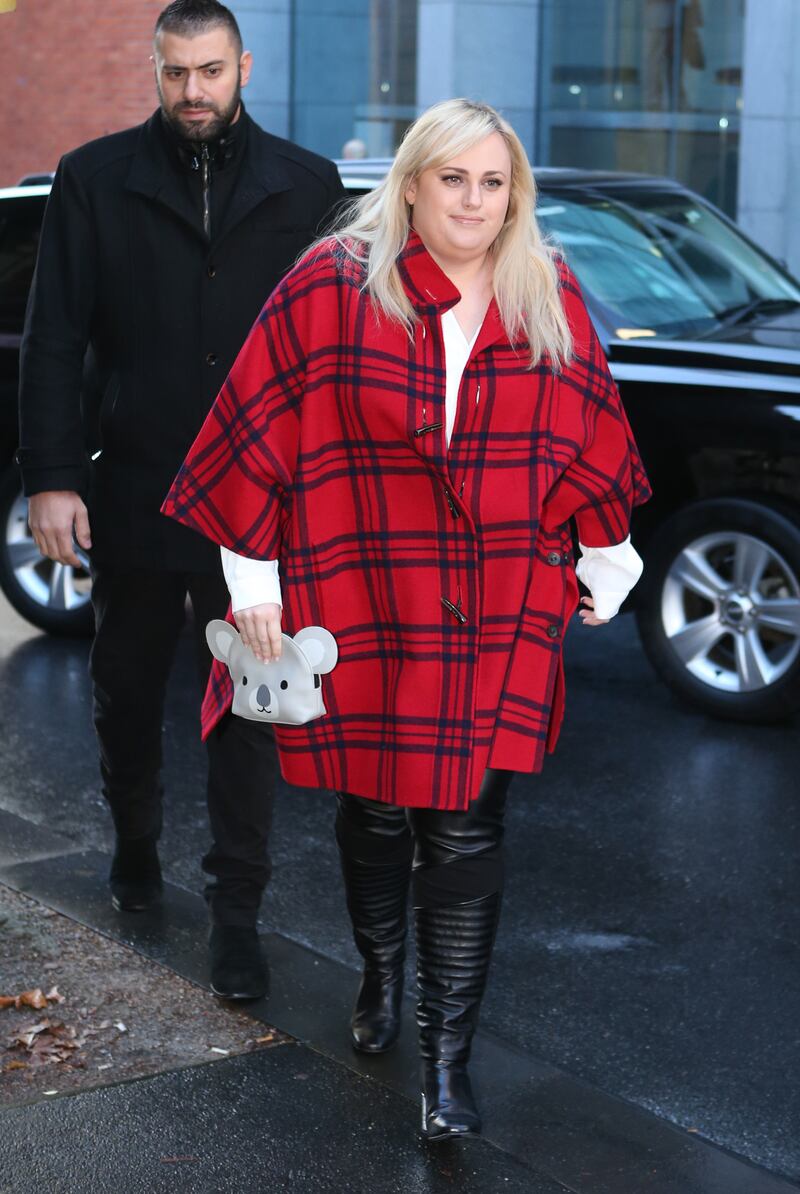 Rebel Wilson, wearing an oversize checked shirt with leather trousers and a koala clutch, arrives at a court in Melbourne on May 31, 2017. EPA