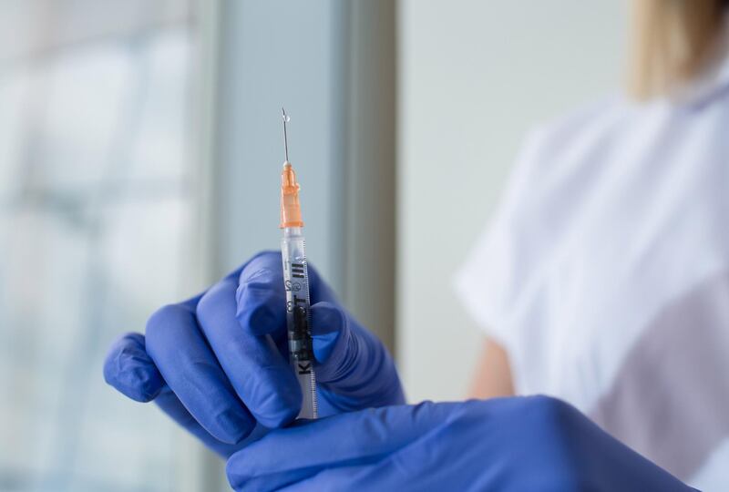 A droplet of liquid falls from a syringe needle in this arranged photograph taken at the Chaika Clinic in Moscow, Russia, on Monday, Aug. 10, 2020. Russia registered its first coronavirus vaccine, President Vladimir Putin said during a televised meeting with the government. Photographer: Andrey Rudakov/Bloomberg