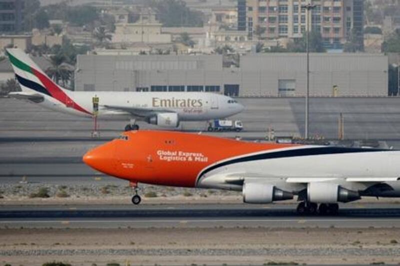 Dubai - July 29th  ,  2008 - Stock Picture of a TNT Cargo plane landing on  the runway at Dubai International Airport ( Andrew Parsons  /  The National ) *** Local Caption ***  ap0010-2907-dubai airport stock.jpgap0010-2907-dubai airport stock.jpg