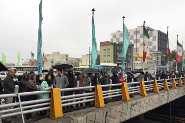 People stand in the street to show their protest against increased gas price in Tehran, Iran on November 16, 2019. WANA (West Asia News Agency) via Reuters