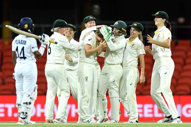 Australia's Georgia Wareham celebrates with teammates after dismissing Shafali Verma of India during the Test match at Metricon Stadium on the Gold Coast in Queensland, on Sunday, October 3. Getty