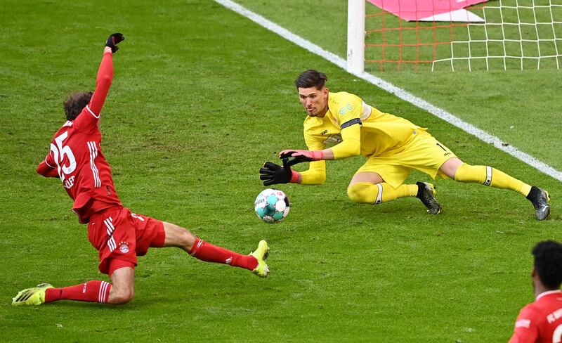 Stuttgart goalkeeper Gregor Kobesaves Bayern's Thomas Muller. AP