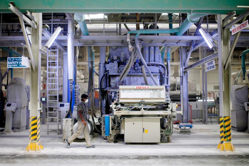Ras Al Khaimah, June 19, 2013 - Workers keep watch over the machines that press tiles at the RAK Ceramics factory in Ras Al Khaimah, June 19, 2013. (Photo by: Sarah Dea/The National)


     This set of photos is for a photo page in Business to run over Ramadan 2013. DO NOT USE BEFORE THEN.