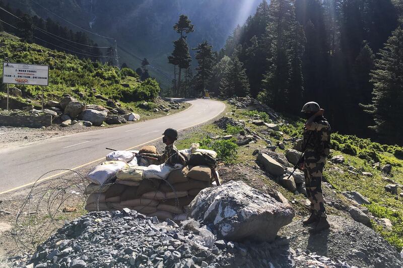 Indian Border Security Force (BSF) soldiers guard a highway leading towards Leh, bordering China, in Gagangir. The long-running border dispute between Asian nuclear powers India and China turned deadly for the first time in nearly half a century after at least 20 Indian soldiers were killed in a "violent face-off", the army said on June 16.  AFP