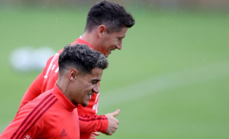 Coutinho and Robert Lewandowski warm up. Getty Images