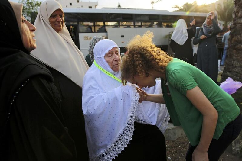 A Palestinian in Gaza City says goodbye to a relative before leaving for the holy city of Mecca for Haj. Adel Hana / AP Photo