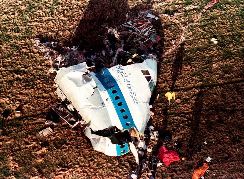 Police and investigators look at what remains of the nose of Pan Am 103 in 1988.