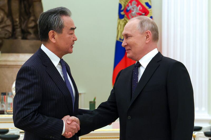 China's most senior diplomat Wang Yi meeting Russian President Vladimir Putin at the Kremlin. AP