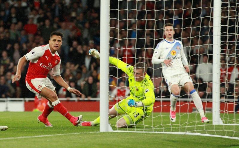 Alexis Sanchez, left, scored both goals in Arsenal's 2-0 win over Sunderland. Sean Dempsey / EPA