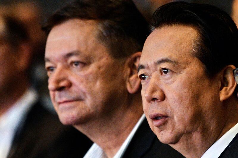 (FILES) In this file photo taken on July 04, 2017 Interpol vice president Alexander Prokopchuk (L) and and Meng Hongwei, president of Interpol, attend the opening of the Interpol World Congress in Singapore on July 4, 2017. The Kremlin on November 20, 2018 denounced "interference" in the election for a new Interpol president after critics including US senators objected to a Russian becoming chief of the global police body. / AFP / ROSLAN RAHMAN
