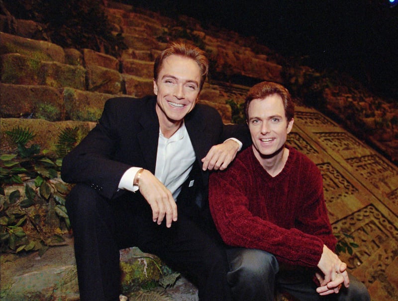 David Cassidy, left, and brother Patrick sit on the stage of EFX at the MGM Grand in Las Vegas. AP Photo/Jack Dempsey